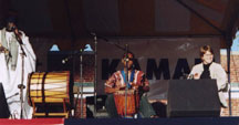 Left to right, Babatunde Olatunji, Alvin Carter, and Toni Kellar performing at Bloomfield Drum Festival, CT 2001 (also on stage and missing from photo: Bob Bloom)